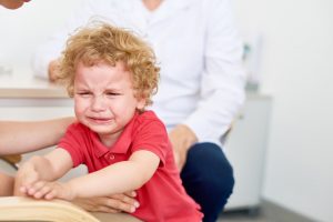 Crying Little Boy at Pediatrician Office
