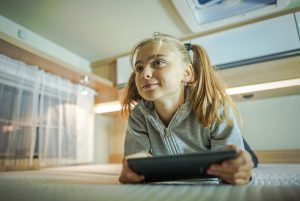 Girl with Tablet Inside RV