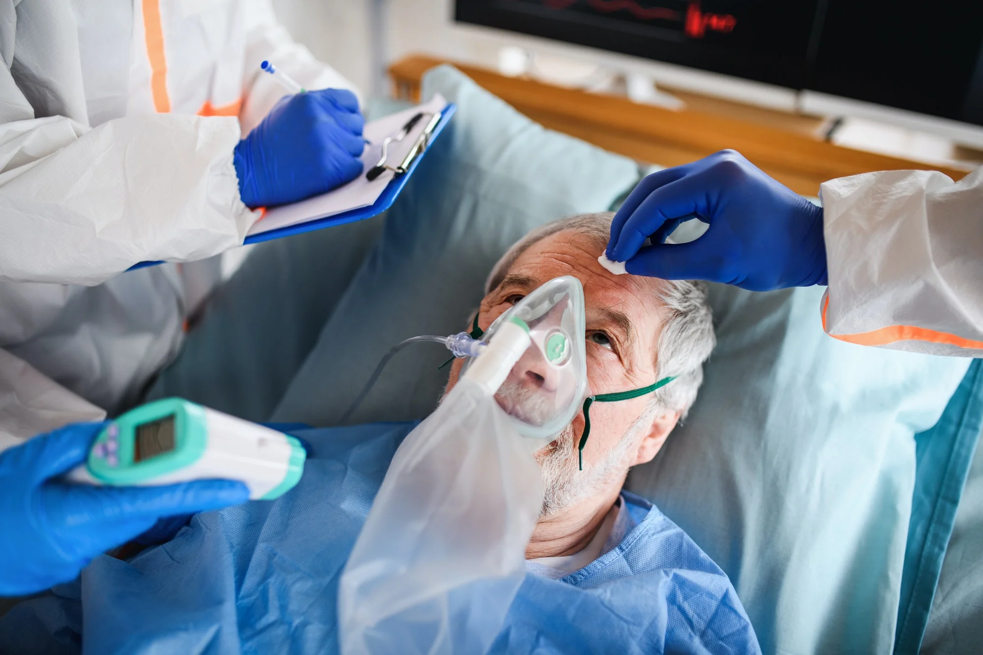 Infected patient in quarantine lying in bed in hospital, coronavirus concept