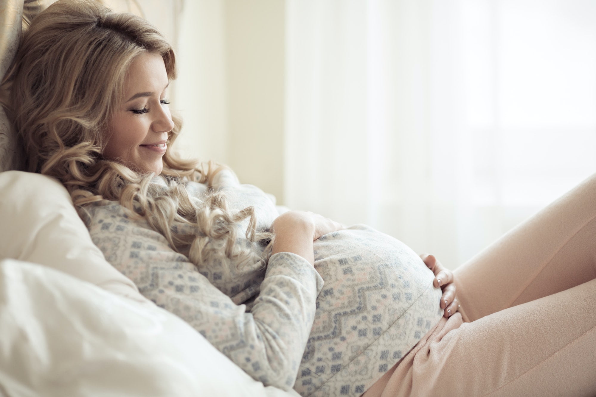 Beautiful Pregnant Woman In Cozy Clothes.