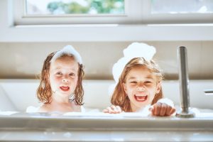 children are bathing in a bath