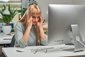 Woman feels tired while working in the office