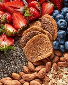 Fresh organic ingredients for dietary homemade natural breakfast - berries, granola, nuts, chia