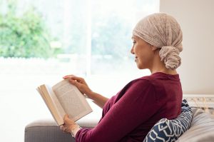 Cancer mature woman reading book